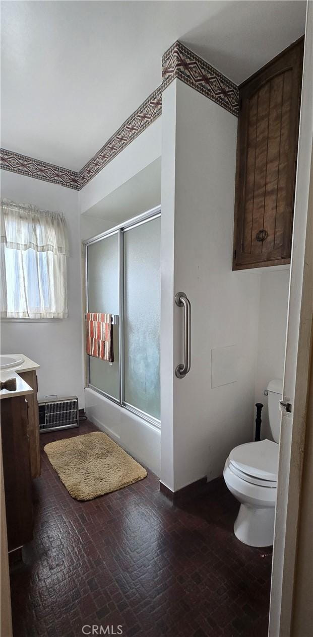 full bathroom with visible vents, vanity, toilet, and an enclosed shower