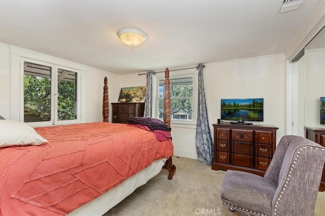 bedroom featuring carpet, visible vents, and crown molding