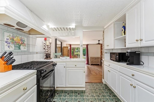 kitchen featuring open shelves, custom range hood, decorative backsplash, white cabinets, and black appliances