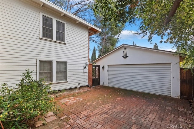 detached garage with fence