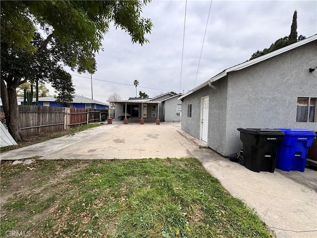 view of yard with fence and a patio area