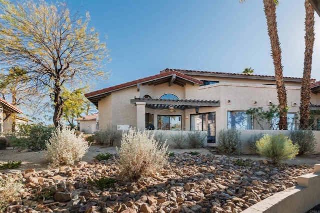 mediterranean / spanish-style home with stucco siding