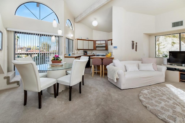 dining space with light carpet, high vaulted ceiling, beam ceiling, and visible vents