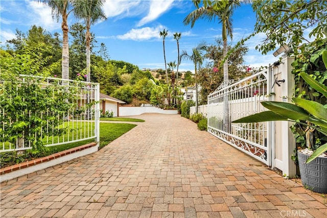 view of gate with fence