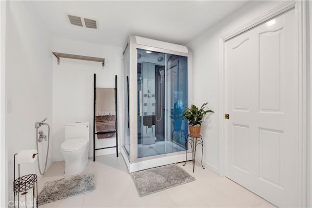 bathroom with toilet and visible vents