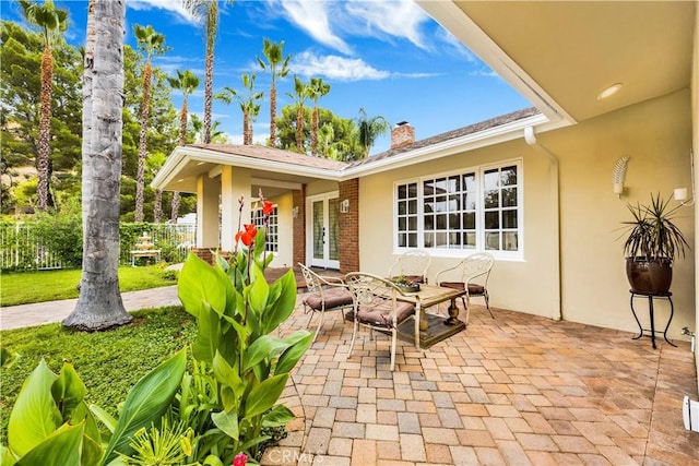 view of patio featuring fence