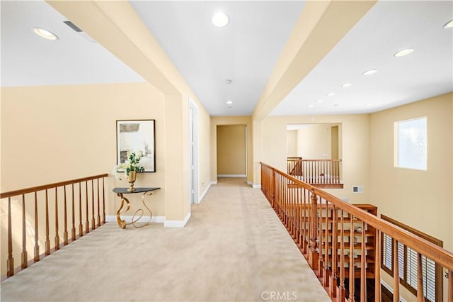 hallway with an upstairs landing, carpet, recessed lighting, and baseboards