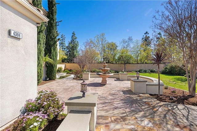 view of patio featuring fence