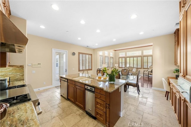 kitchen featuring ventilation hood, stainless steel dishwasher, stone tile flooring, and a sink