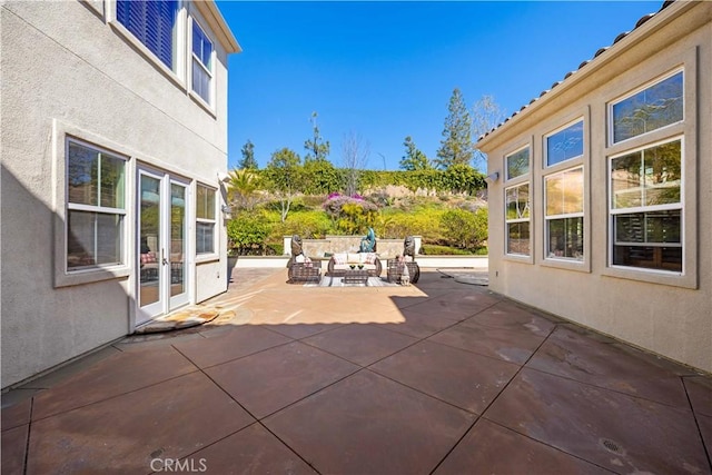 view of patio featuring french doors and outdoor lounge area