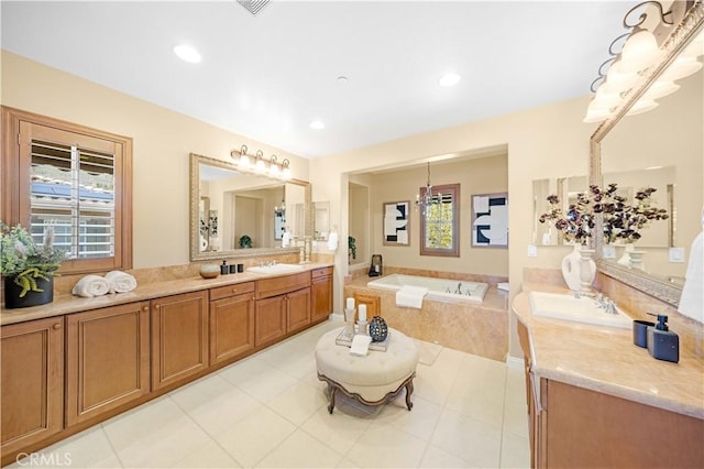 full bathroom with vanity, a garden tub, recessed lighting, and tile patterned flooring