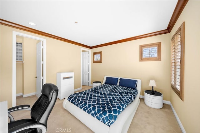 bedroom with crown molding, carpet flooring, and baseboards