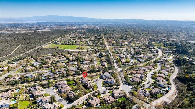 birds eye view of property featuring a residential view and a mountain view