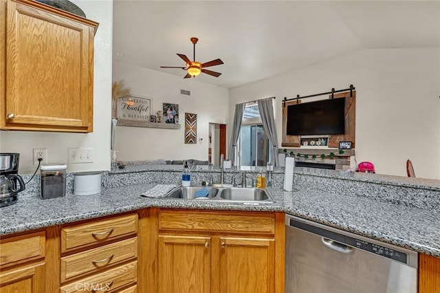 kitchen featuring dishwasher, a sink, a ceiling fan, and light stone countertops