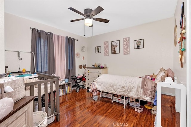 bedroom with ceiling fan and wood finished floors