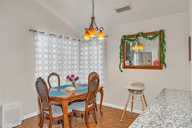 dining room with baseboards and visible vents