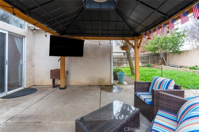 view of patio / terrace featuring fence