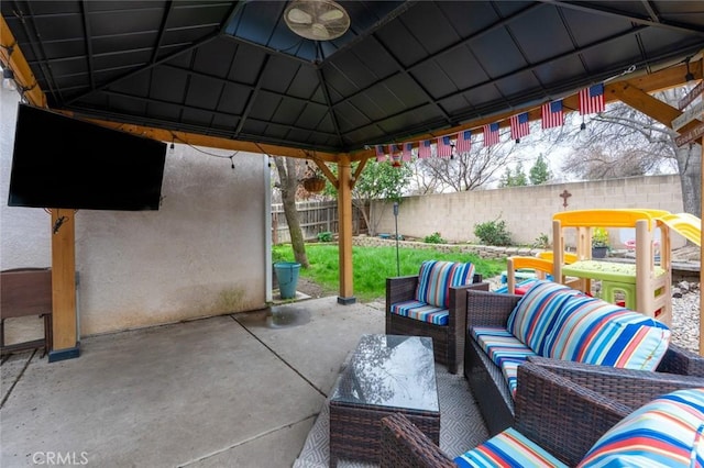 view of patio / terrace with fence, outdoor lounge area, and a gazebo