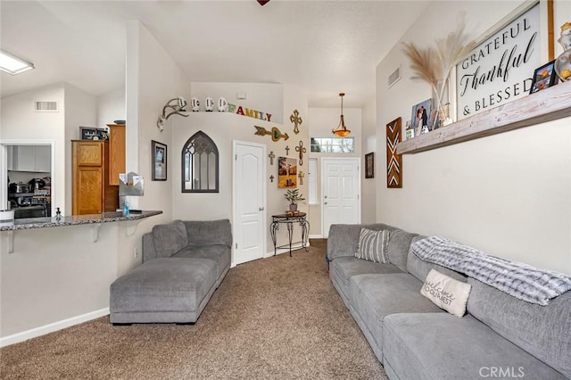 living area with lofted ceiling, carpet, visible vents, and baseboards