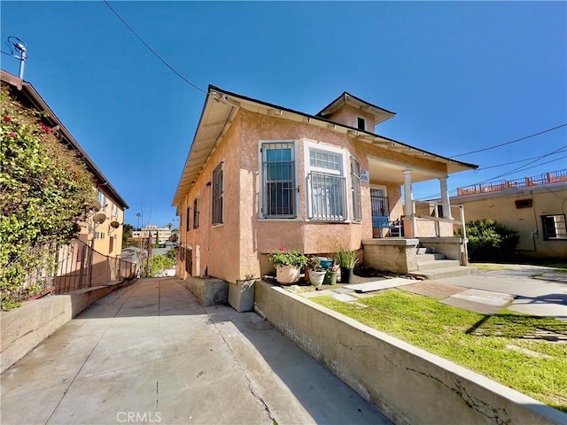 view of front of property with stucco siding and a porch