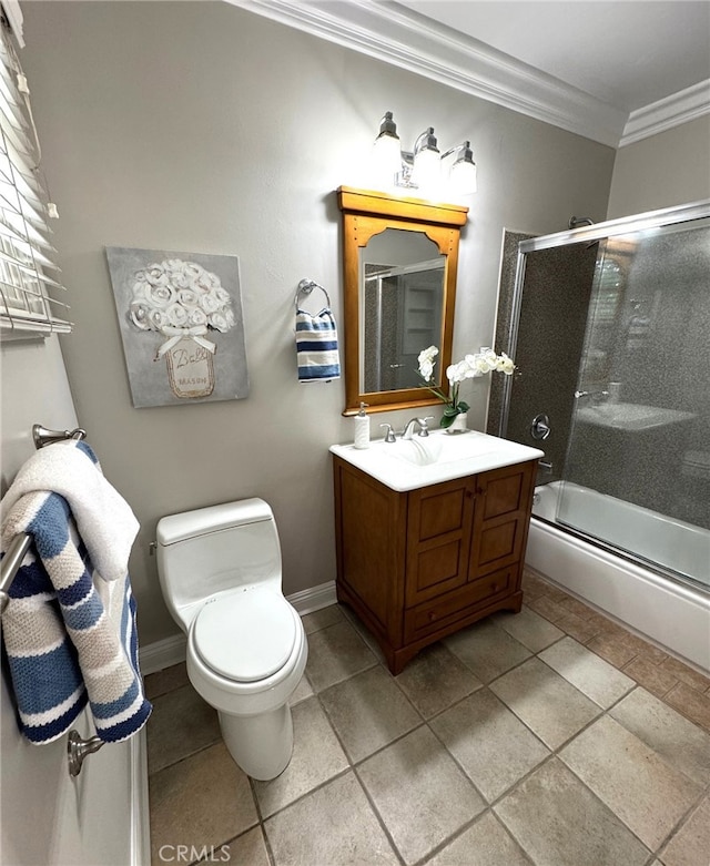 full bathroom featuring crown molding, toilet, an enclosed shower, vanity, and baseboards