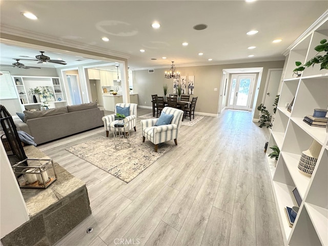 living room with baseboards, light wood finished floors, recessed lighting, and crown molding