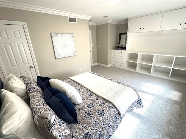 carpeted bedroom with baseboards, visible vents, and ornamental molding