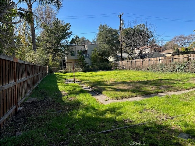 view of yard featuring a fenced backyard