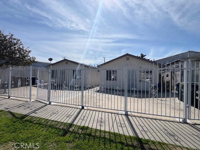 exterior space featuring a gate and a fenced front yard