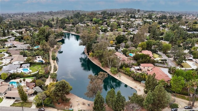 drone / aerial view with a residential view and a water view