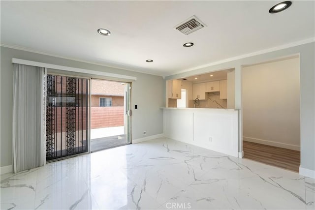 spare room with recessed lighting, crown molding, baseboards, and visible vents