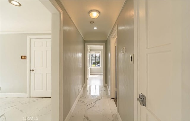 hall featuring marble finish floor, ornamental molding, baseboards, and recessed lighting