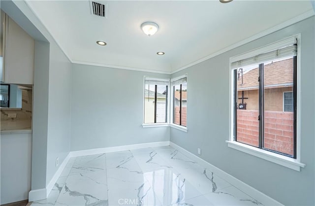 spare room with marble finish floor, baseboards, and recessed lighting