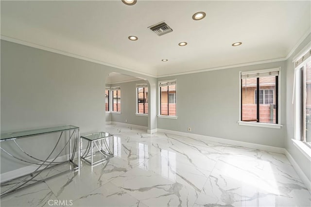 unfurnished room featuring marble finish floor, baseboards, visible vents, arched walkways, and recessed lighting