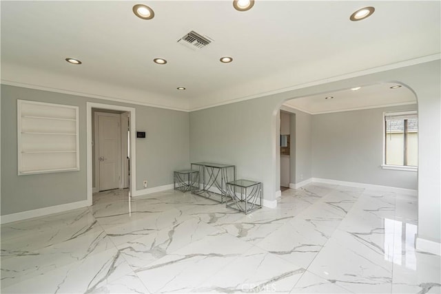 unfurnished room with arched walkways, visible vents, recessed lighting, and crown molding