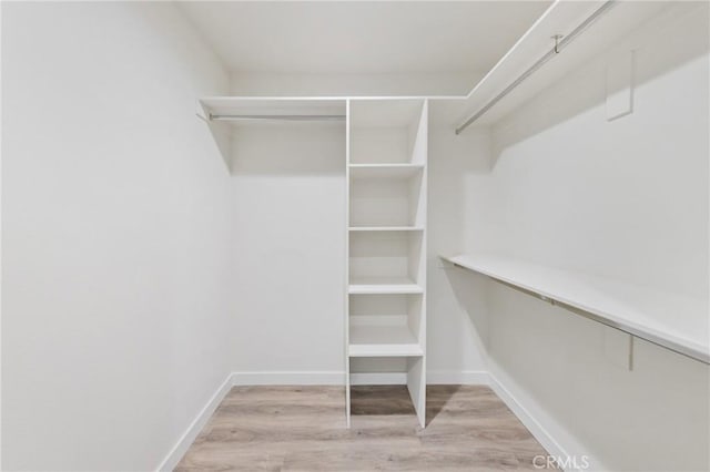 walk in closet featuring light wood-style floors