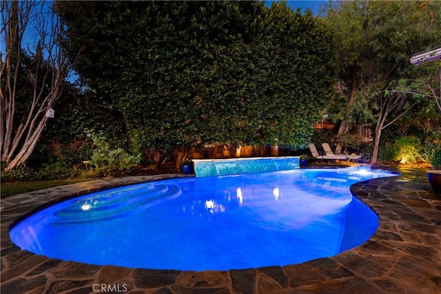 view of swimming pool featuring fence and a fenced in pool