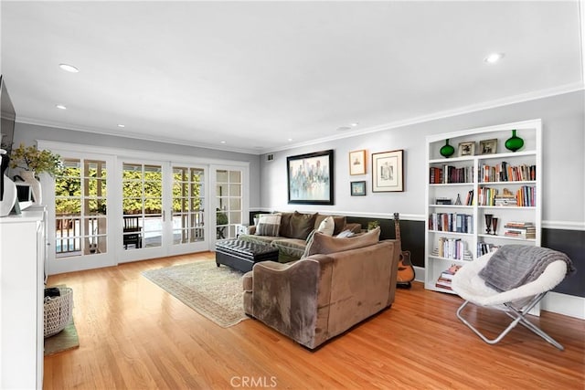 living room featuring ornamental molding, recessed lighting, french doors, and wood finished floors