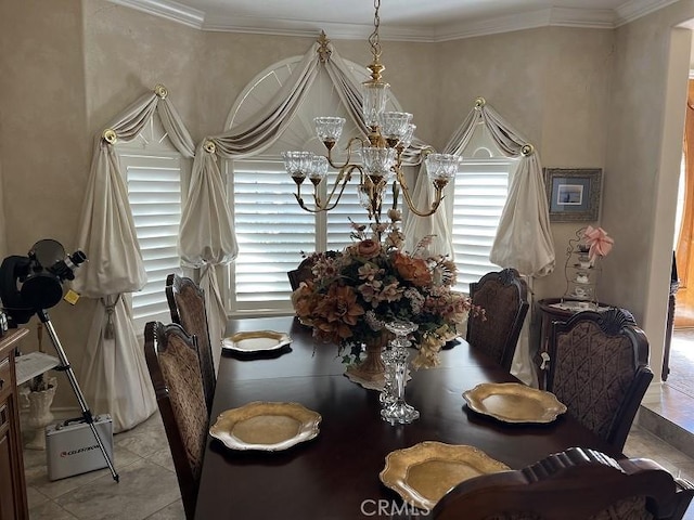 dining space with an inviting chandelier, crown molding, and light tile patterned flooring