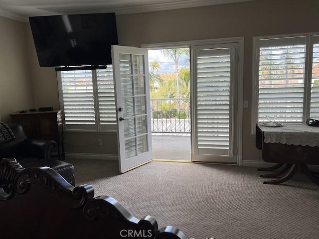 interior space featuring ornamental molding and baseboards