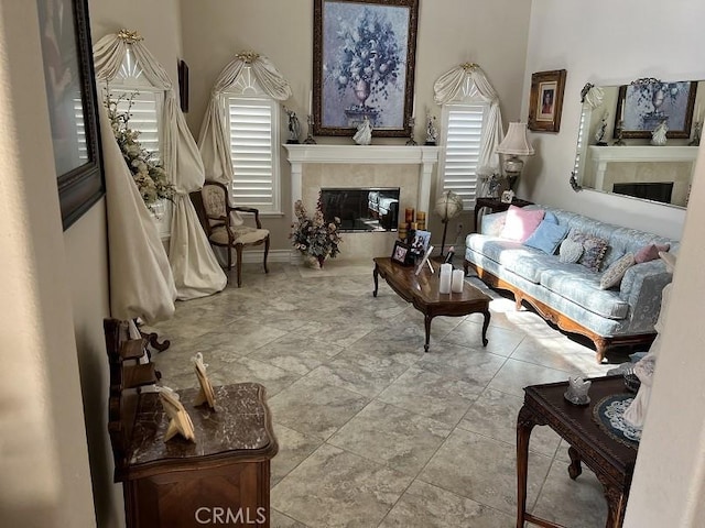 living area featuring a fireplace and tile patterned flooring