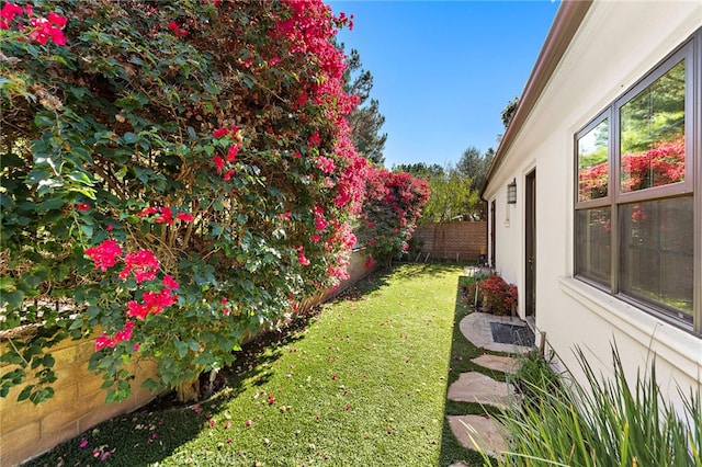 view of yard with a fenced backyard