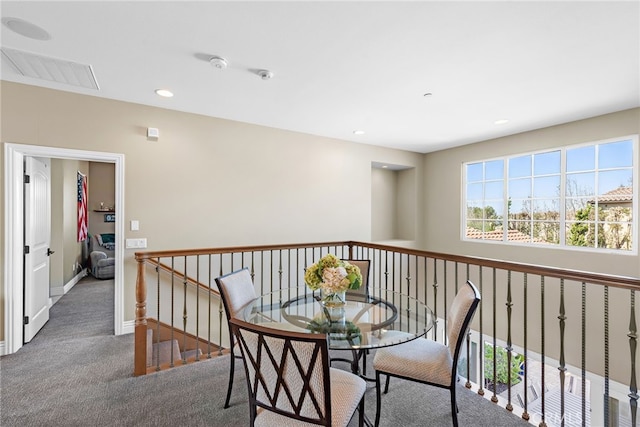 interior space with recessed lighting, carpet flooring, visible vents, and baseboards