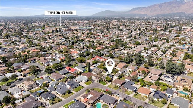 drone / aerial view featuring a residential view and a mountain view