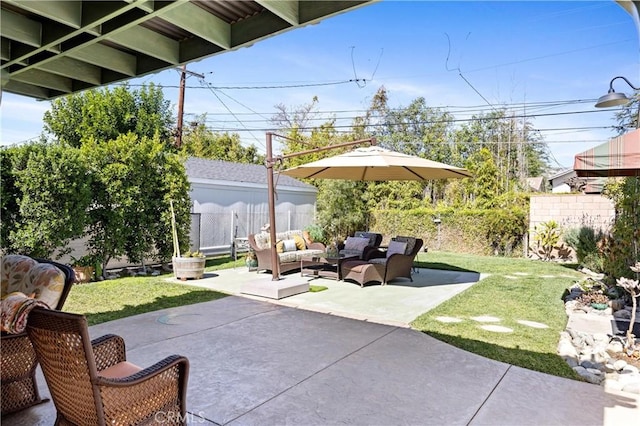 view of patio with outdoor lounge area and a fenced backyard