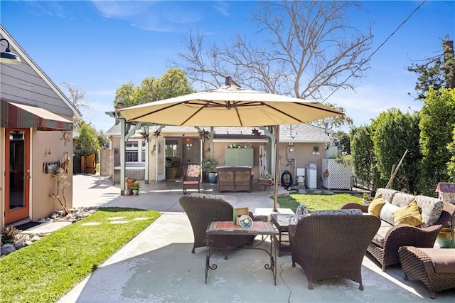 view of patio featuring fence and outdoor lounge area