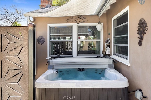 view of patio featuring a hot tub