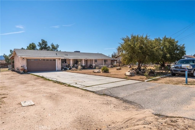 ranch-style house featuring driveway and an attached garage