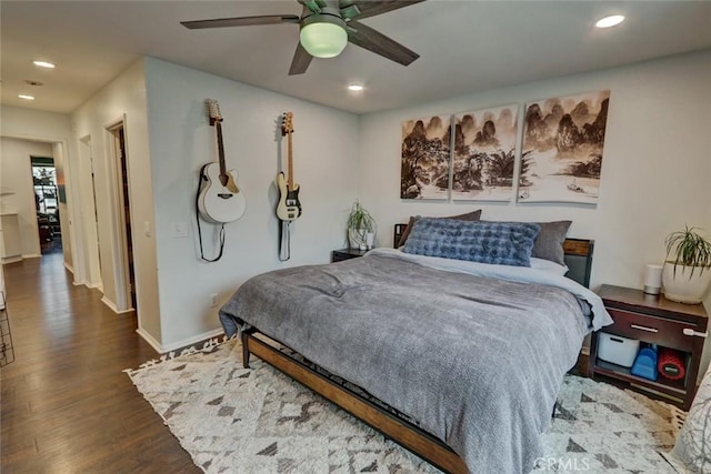 bedroom featuring a ceiling fan, baseboards, dark wood-type flooring, and recessed lighting