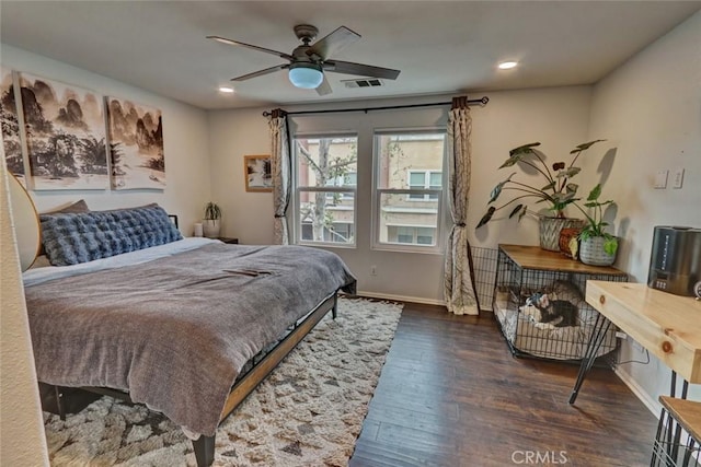 bedroom featuring recessed lighting, wood finished floors, visible vents, and baseboards